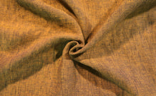 Load image into Gallery viewer, close up image of gold and navy yarn dye fabric. Fabric is bunched in the middle to show the drape, texture, and color variance of the linen fabric.