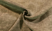 Load image into Gallery viewer, Close up image of black and cream yarn dye fabric. Fabric is bunched in the middle to show the drape, texture, and color variance of the linen fabric.
